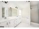 Bathroom with double vanity and large bathtub at 308 Royal Crescent Way, Stockbridge, GA 30281