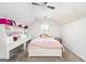 Bright bedroom with built-in shelving and a comfortable bed at 308 Royal Crescent Way, Stockbridge, GA 30281