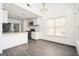 Renovated kitchen featuring granite countertops and modern appliances at 308 Royal Crescent Way, Stockbridge, GA 30281