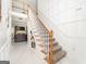 Elegant staircase with a built-in shelf and marble flooring at 308 Royal Crescent Way, Stockbridge, GA 30281