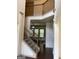 Open staircase with wrought-iron railing at 1830 Alder Tree Way, Dacula, GA 30019