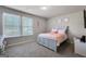 Bedroom with a queen bed and light decor at 60 Ascott Trce, Covington, GA 30016