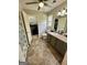 Bathroom with vanity, toilet, shower and walk-in closet at 470 Harris Rockmore Loop, Covington, GA 30014