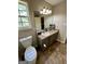 Bathroom with vanity, toilet and tiled floor at 470 Harris Rockmore Loop, Covington, GA 30014