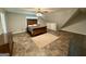 Spacious bedroom with a queen bed and ceiling fan at 470 Harris Rockmore Loop, Covington, GA 30014