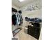 Walk-in closet with shelves and hanging rods at 470 Harris Rockmore Loop, Covington, GA 30014