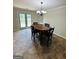 Dining area with a round table, chairs, and access to a deck at 470 Harris Rockmore Loop, Covington, GA 30014