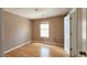 A well-lit bedroom featuring hardwood floors and a window bringing in natural light at 5738 Antelope Trl, Atlanta, GA 30349