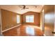A basic bedroom featuring hardwood floors and dual windows for natural light at 5738 Antelope Trl, Atlanta, GA 30349