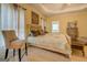 Main bedroom with a king-size bed and a chair at 557 Arrowhead Cir, Rutledge, GA 30663