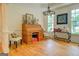 Bright home office featuring hardwood floors and a vintage roll-top desk at 557 Arrowhead Cir, Rutledge, GA 30663