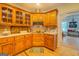 A kitchen featuring wooden cabinetry, countertops, and hardwood floors at 557 Arrowhead Cir, Rutledge, GA 30663