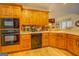 Kitchen boasts double oven, wood cabinets, and a corner sink at 557 Arrowhead Cir, Rutledge, GA 30663