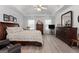 Main bedroom with wood flooring, large windows, and ceiling fan at 1152 Strath Clyde Way, Mcdonough, GA 30253