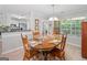 Bright dining room with hardwood floors and a wooden table at 1152 Strath Clyde Way, Mcdonough, GA 30253