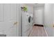 Convenient laundry room with washer, dryer, and extra storage at 1152 Strath Clyde Way, Mcdonough, GA 30253