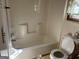 A bathroom with a bathtub and toilet needing updating at 5303 Kemper Pl, Stone Mountain, GA 30088