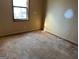 A bedroom with a window and damaged flooring needing repair at 5303 Kemper Pl, Stone Mountain, GA 30088