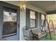 Covered porch with seating and a view of the yard at 5303 Kemper Pl, Stone Mountain, GA 30088