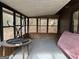 Screened porch with wooden frame and backyard view at 5303 Kemper Pl, Stone Mountain, GA 30088