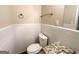 Simple bathroom with white tile and granite countertop at 2304 Springdale Sw Cir, Atlanta, GA 30315