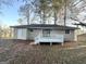 House with deck and storage shed in backyard at 3993 Flakes Mill Rd, Decatur, GA 30034