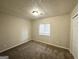 Simple bedroom with carpeted floor at 3993 Flakes Mill Rd, Decatur, GA 30034