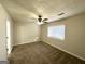 Cozy carpeted bedroom with ceiling fan at 3993 Flakes Mill Rd, Decatur, GA 30034