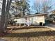 House exterior with deck and landscaping at 3993 Flakes Mill Rd, Decatur, GA 30034