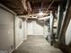 Unfinished basement with laundry hookups and HVAC system at 3786 Glen Mora Dr, Decatur, GA 30032