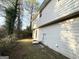 Side view of house showing exterior siding and landscaping at 3786 Glen Mora Dr, Decatur, GA 30032