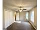 Large main bedroom with carpet, ceiling fan and double doors at 3786 Glen Mora Dr, Decatur, GA 30032