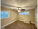 Well-lit bedroom with neutral carpeting and ceiling fan at 2920 Springside Se Pl, Atlanta, GA 30354