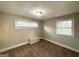 Spacious bedroom with neutral carpeting and dual windows at 2920 Springside Se Pl, Atlanta, GA 30354