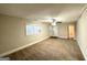 Spacious living room featuring neutral carpeting and ample natural light at 2920 Springside Se Pl, Atlanta, GA 30354