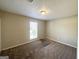 Spacious bedroom with neutral walls and carpet flooring at 3205 Cadiz Cir, South Fulton, GA 30349