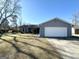 Gray exterior house with a white garage door and a well-maintained lawn at 3205 Cadiz Cir, South Fulton, GA 30349