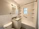 Clean bathroom with granite countertop and built-in shelving at 3226 Browns Mill Se Rd, Atlanta, GA 30354