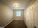 Cozy bedroom with neutral carpeting and ample closet space at 3226 Browns Mill Se Rd, Atlanta, GA 30354