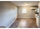 Simple dining area with wood-look floors and access to kitchen at 3226 Browns Mill Se Rd, Atlanta, GA 30354