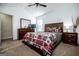 Main bedroom with dresser, TV, and large bed at 87 Mossy Oak Ln, Dallas, GA 30157