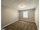 Cozy carpeted bedroom with a window and double door closet at 220 Mountain View Cir, Covington, GA 30016