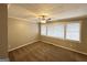 Spacious bedroom with hardwood floors and window at 220 Mountain View Cir, Covington, GA 30016