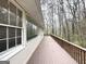 Wooden deck overlooking a wooded area at 220 Mountain View Cir, Covington, GA 30016