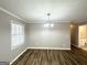 Bright dining area with hardwood floors and chandelier at 220 Mountain View Cir, Covington, GA 30016