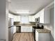 Modern kitchen with white cabinets and granite countertops at 220 Mountain View Cir, Covington, GA 30016