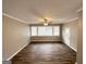 Spacious living room with hardwood floors and large windows at 220 Mountain View Cir, Covington, GA 30016