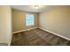 Simple bedroom with neutral walls and carpet flooring at 3951 Wabash Ln, Ellenwood, GA 30294