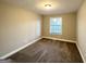 Simple bedroom with neutral walls and carpet flooring at 3951 Wabash Ln, Ellenwood, GA 30294