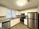 Modern kitchen with white cabinets, stainless steel appliances, and granite countertops at 3951 Wabash Ln, Ellenwood, GA 30294